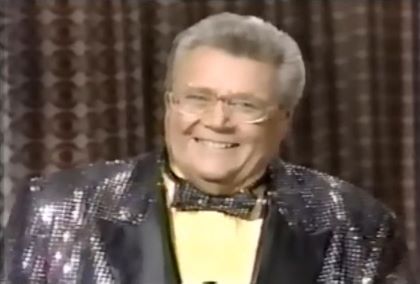 Rod is wearing a black-sequin jacket, matching bow tie & yellow silk shirt