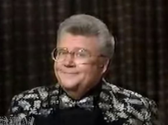 Rod is wearing a black jacket with a silver oak-leaf pattern, matching bow-tie & black shirt