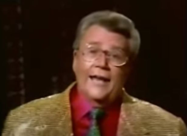 Rod's jacket is yellow sequins, a tie of green sequins & a red shirt