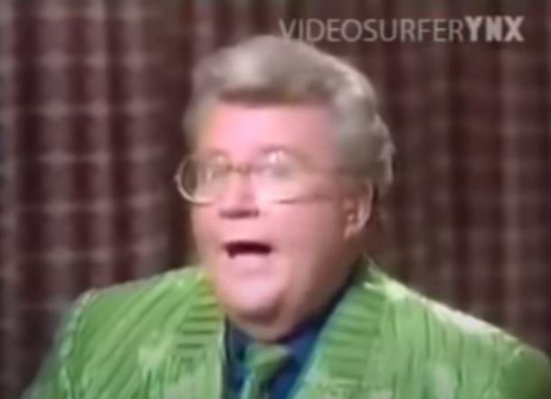 Rod is wearing a green jacket (w/ dark green stripes), matching tie & blue shirt