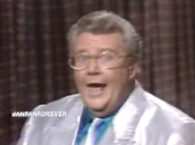 Rod is wearing a silver jacket & tie with a blue silk shirt