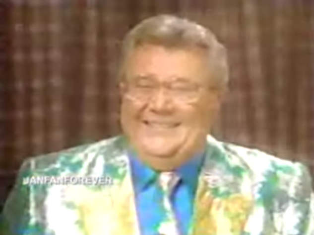 Rod is wearing a shiny silver & green jacket, matching tie & light-blue silk shirt