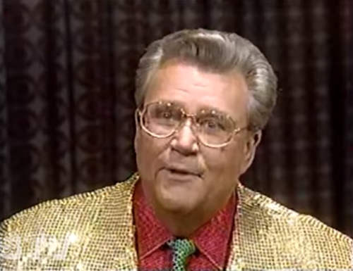 Rod is wearing a gold sequin jacket, green sequin tie & red sequin shirt