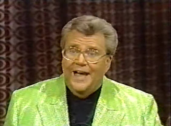 Rod is wearing a lime-green sequined jacket & black collarless silk shirt