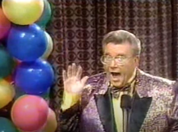 Rod is wearing a Gold/purple Leopard-print jacket & matching bow-tie w/ yellow silk shirt