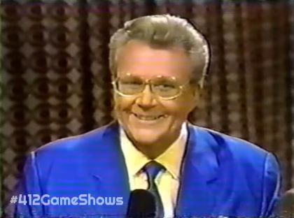 Rod is wearing a blue jacket with matching neck tie & yellow shirt with matching pocket square