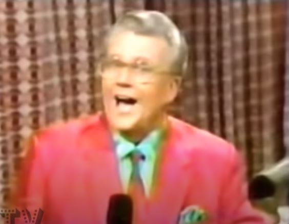 Rod is wearing a a red jacket/tie with a green shirt